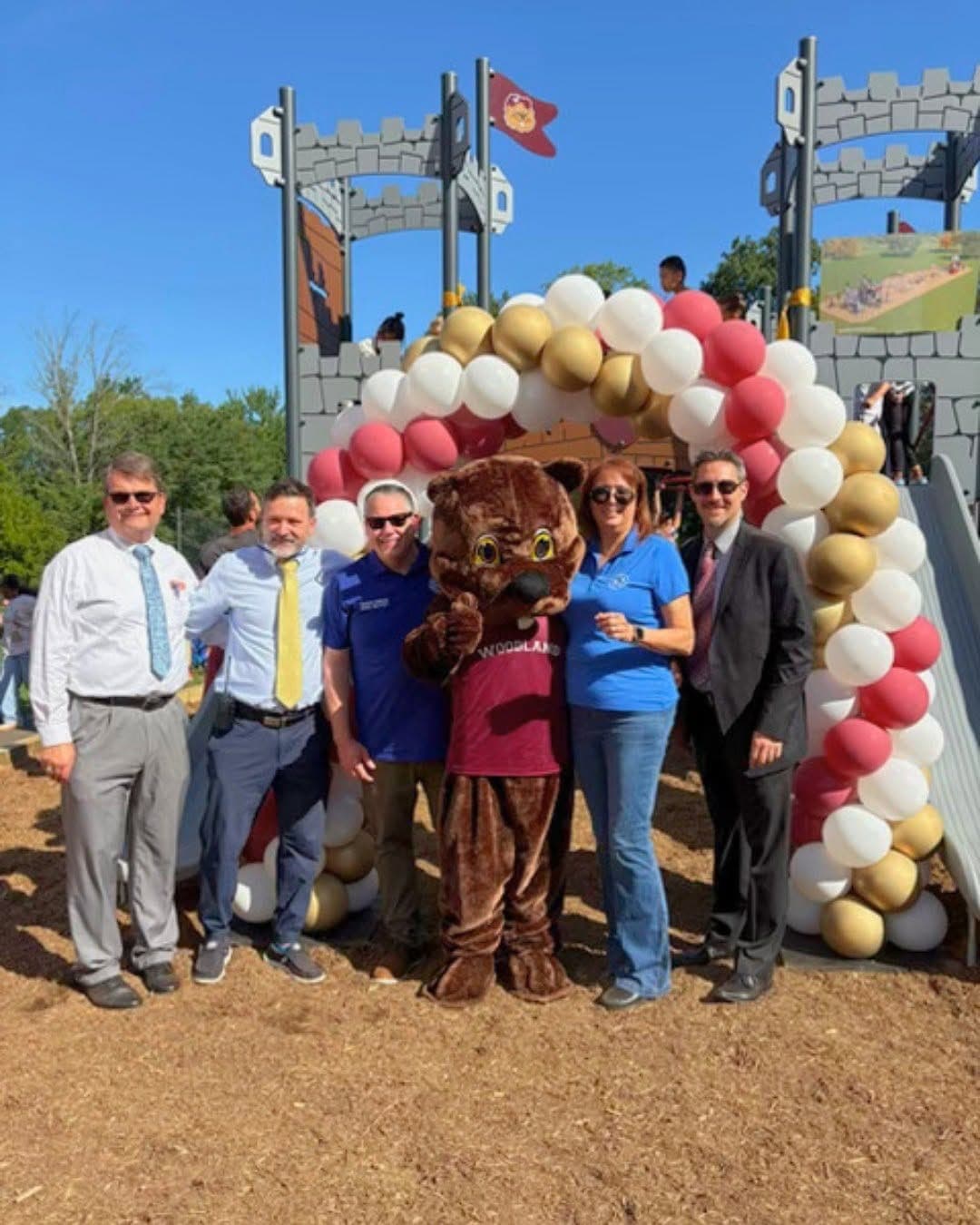 At the Woodland School playground opening are, from left, School Business Administrator Chris Heagele, Principal Jeff Heaney, Committeeman Dan McCarey, Woody Woodchuck, Board of Education President Patricia Zohn and Superintendent Dr. Matthew Mingle.